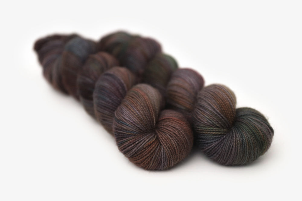 tonal hand dyed orange red gray brown merino sock yarn