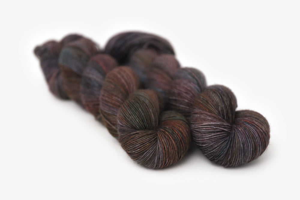 tonal hand dyed orange red gray brown single sock yarn