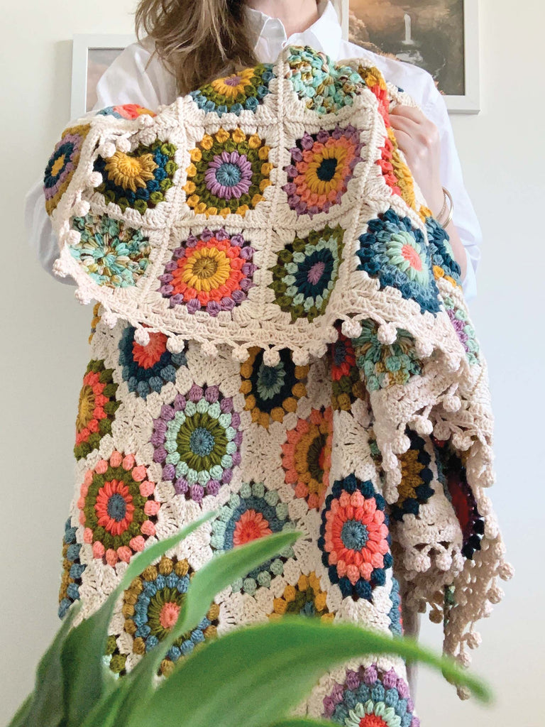 blanket made out of semisolid speckled hand dyed colors of dk yarn
