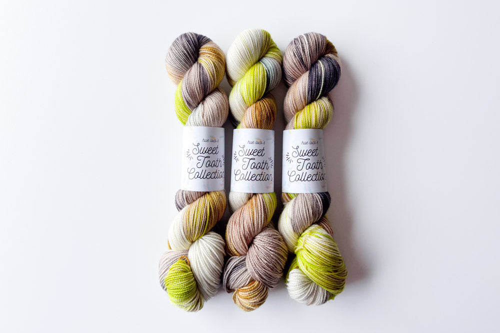 tonal hand dyed white lime green brown gray yarn