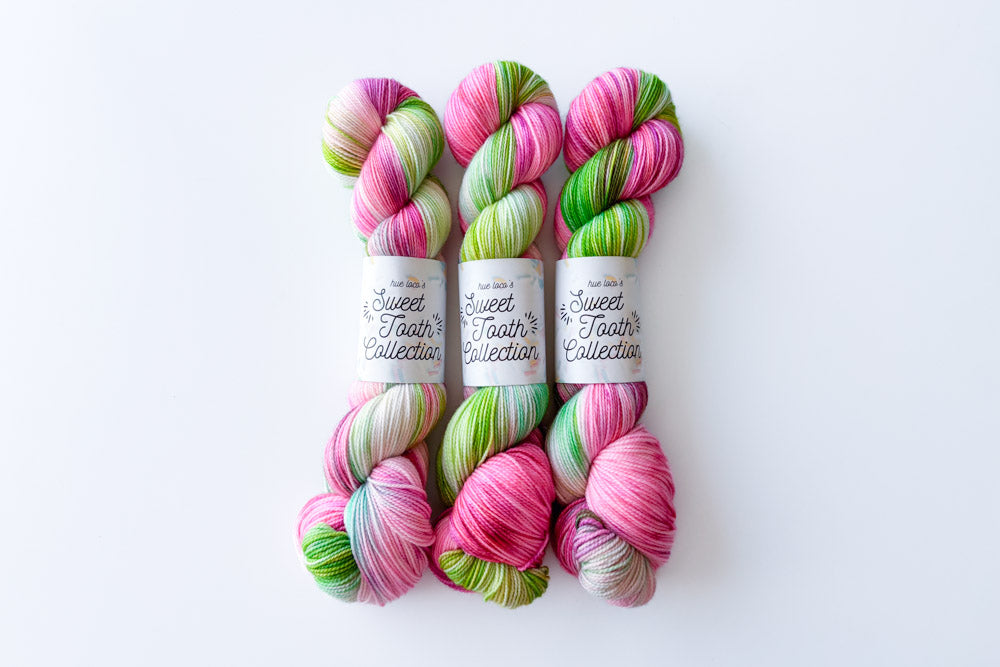 tonal hand dyed pink white green pale cyan yarn