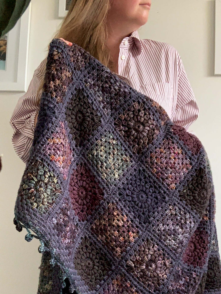 blanket made out of semisolid speckled hand dyed dark night colors of dk yarn