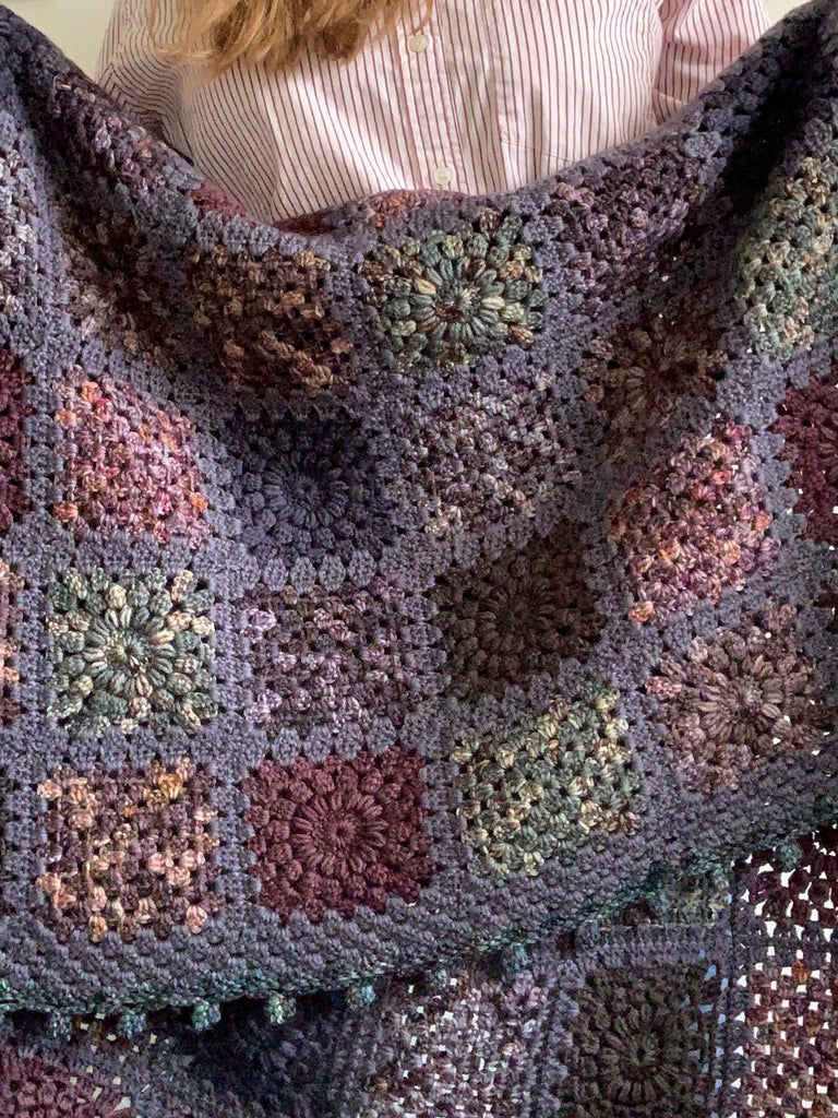 blanket made out of semisolid speckled hand dyed dark night colors of dk yarn