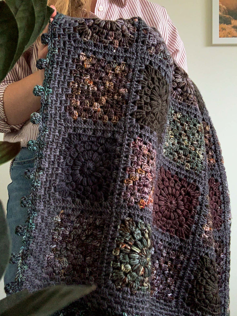 blanket made out of semisolid speckled hand dyed dark night colors of dk yarn