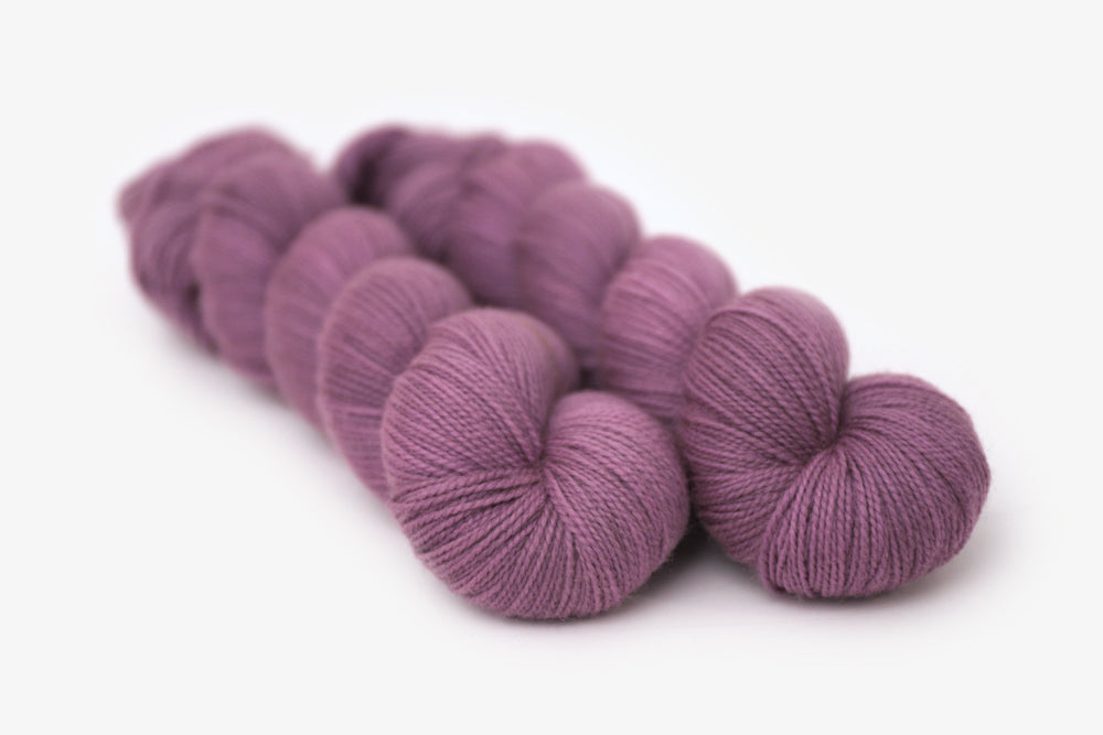 semisolid hand dyed plum (dusty mauve purple) merino sock yarn