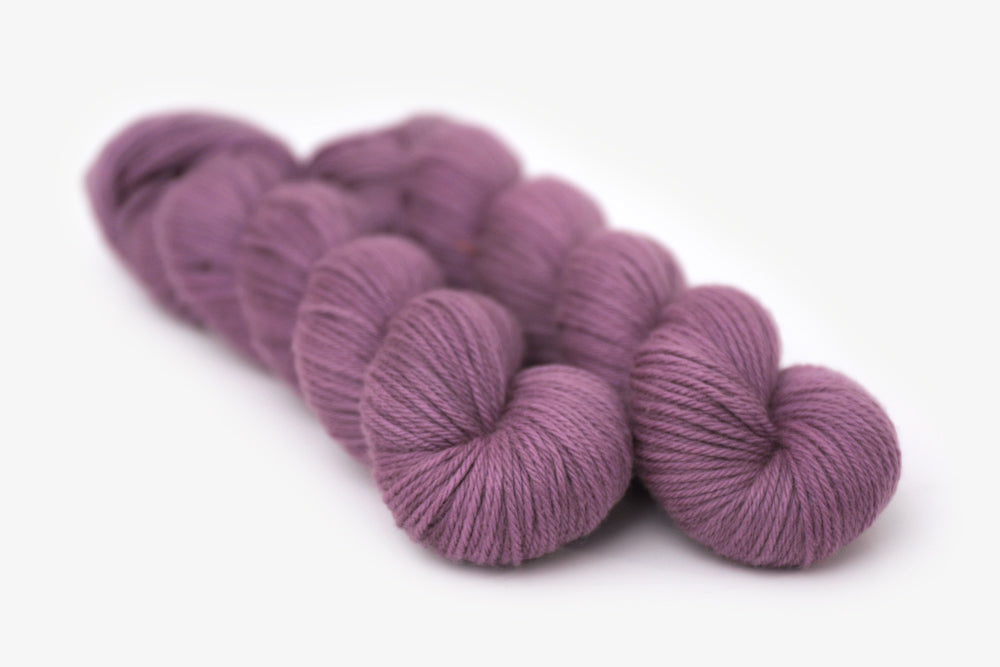 semisolid hand dyed plum (dusty mauve purple) worsted yarn