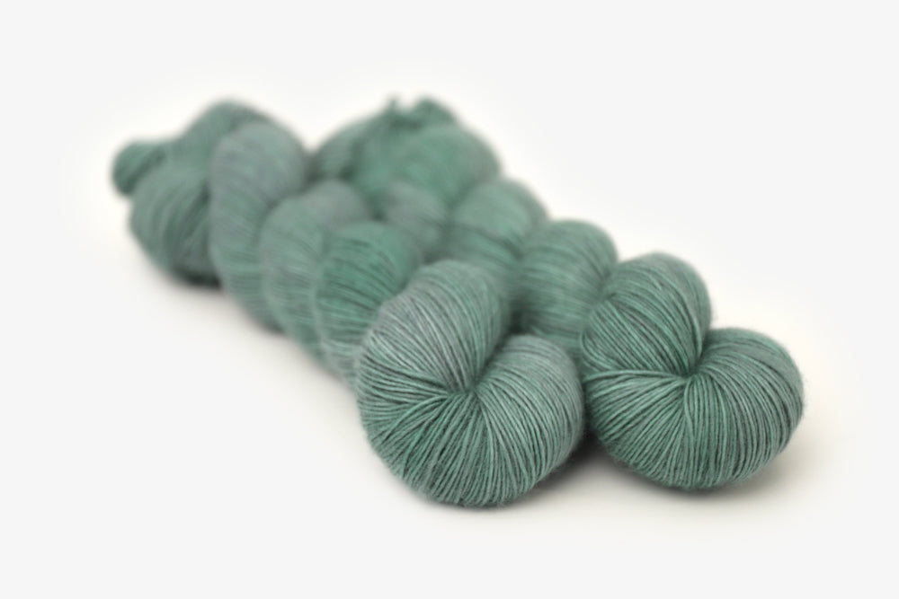 semisolid hand dyed sage green single sock yarn