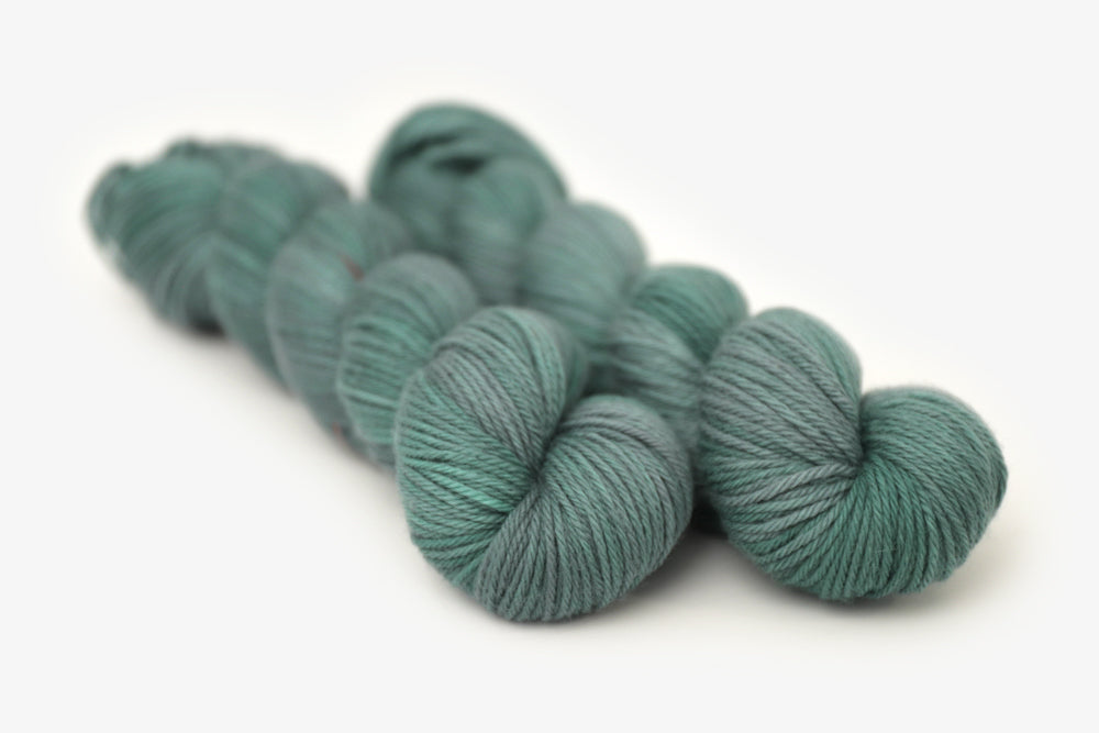 semisolid hand dyed sage green worsted yarn