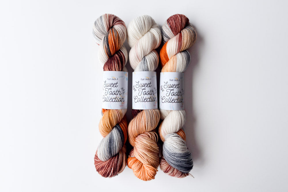 tonal semisolid hand dyed orange peach cream gray blue yarn