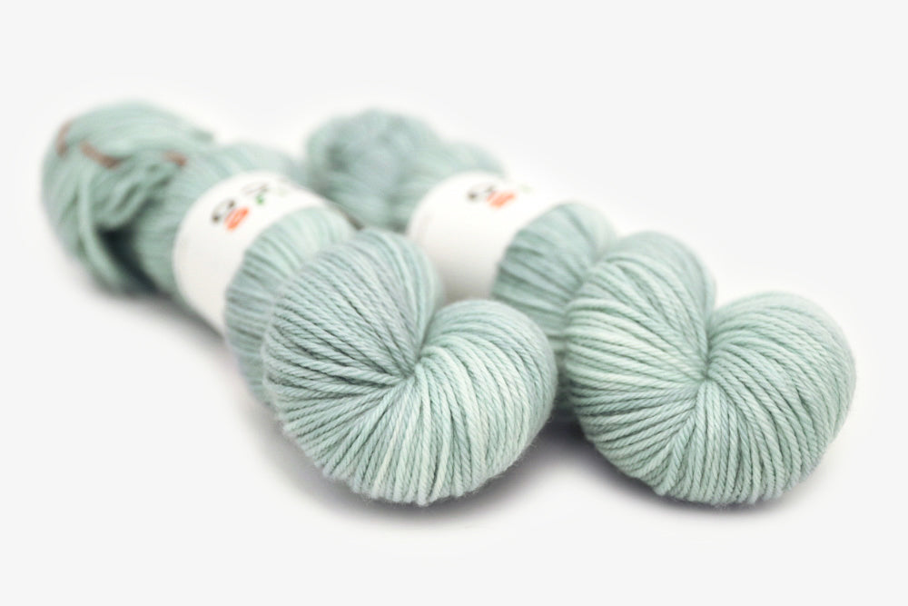 semisolid hand dyed light powder blue worsted yarn