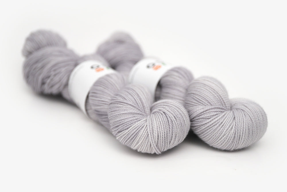 semisolid hand dyed ash (light silver gray) merino sock yarn
