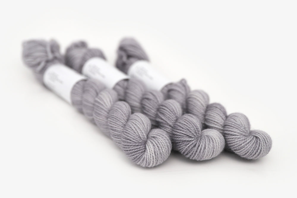 semisolid hand dyed ash (light silver gray) merino sock mini yarn