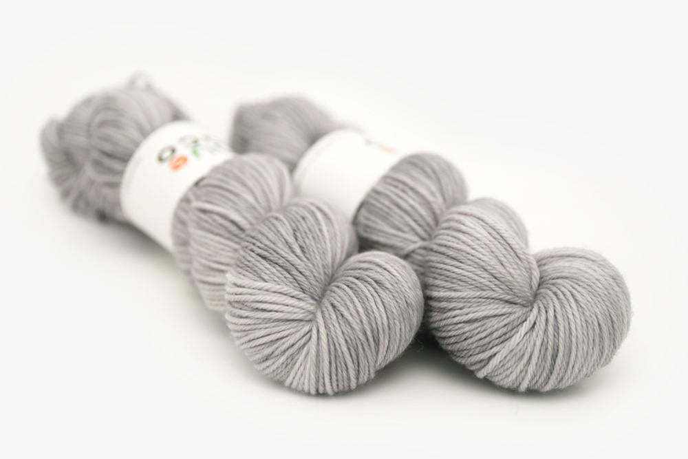 semisolid hand dyed ash (light silver gray) worsted yarn