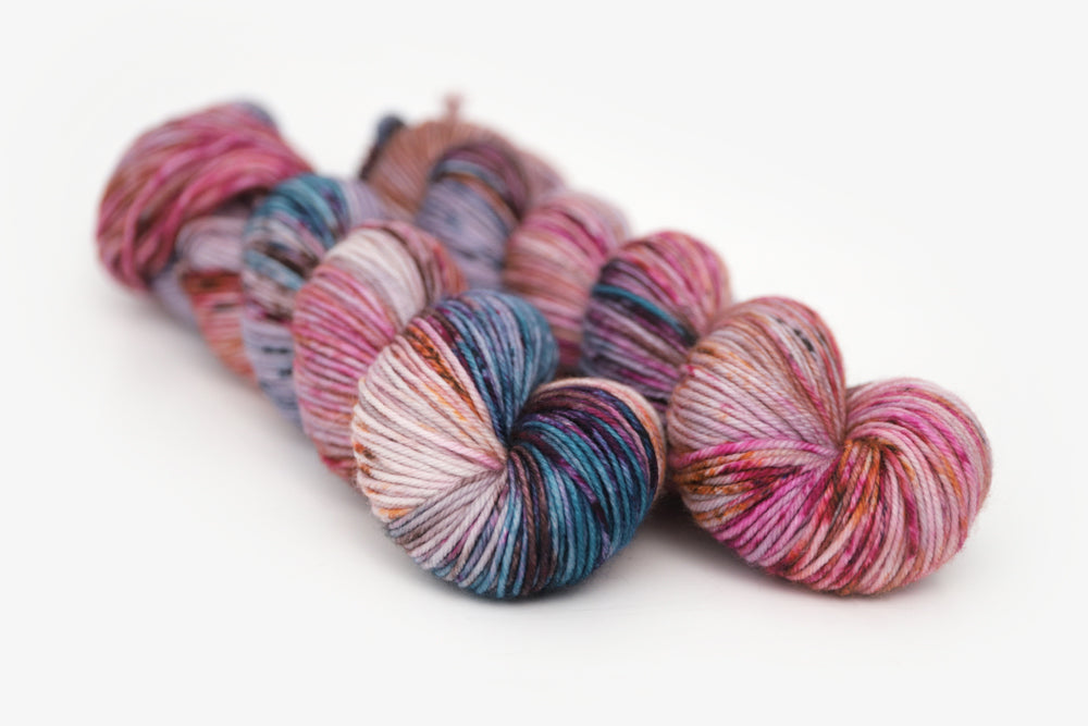 speckled hand dyed lilac teal magenta brown dk yarn