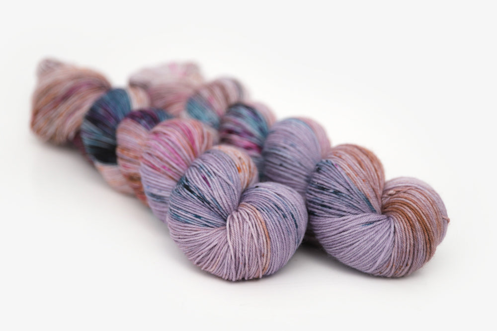 speckled hand dyed lilac teal magenta brown phyllis sock yarn