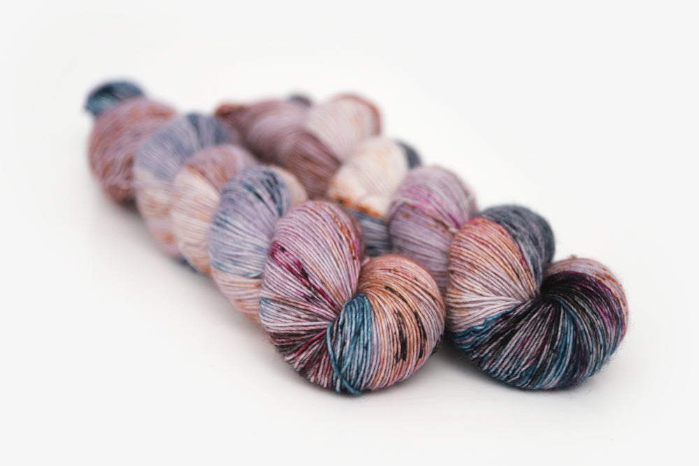 speckled hand dyed lilac teal magenta brown single sock yarn