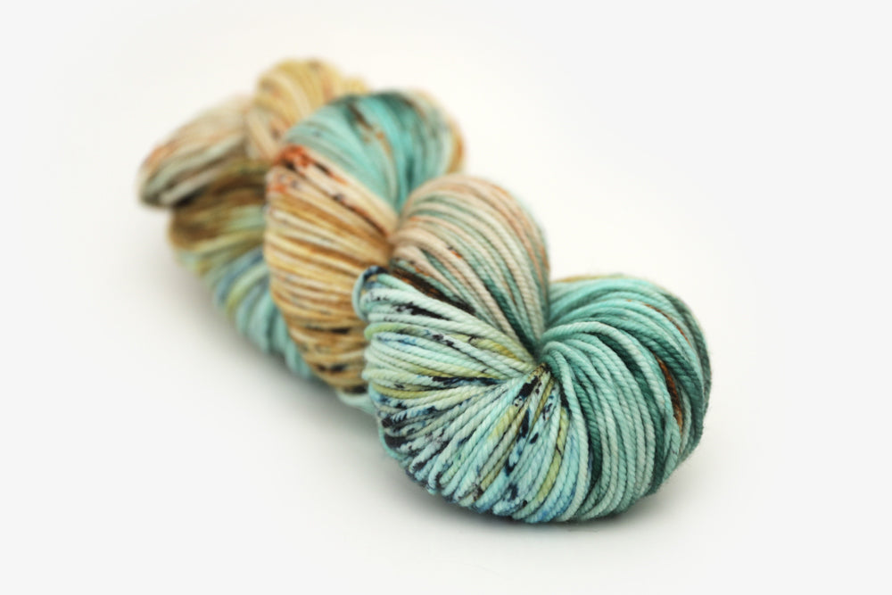 speckled hand dyed bright teal emerald tan orange bulky yarn