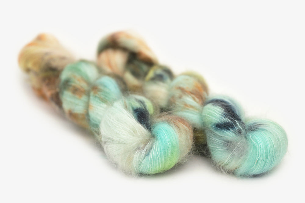 speckled hand dyed bright teal emerald tan orange mohair lace yarn