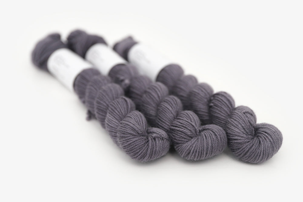 semisolid hand dyed charcoal (dark silver gray) phyllis sock mini yarn