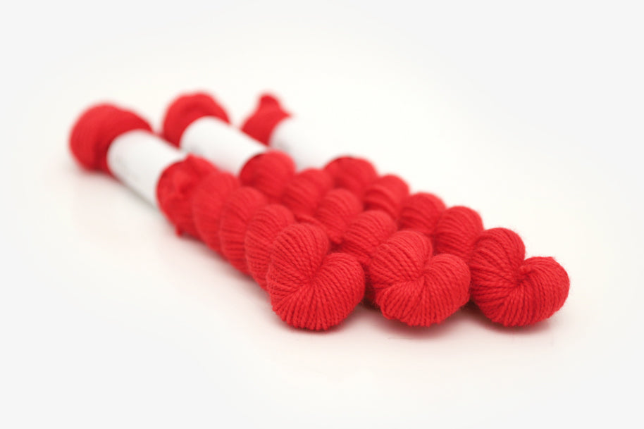 semisolid hand dyed cherry (bright christmas red) merino sock mini yarn 
