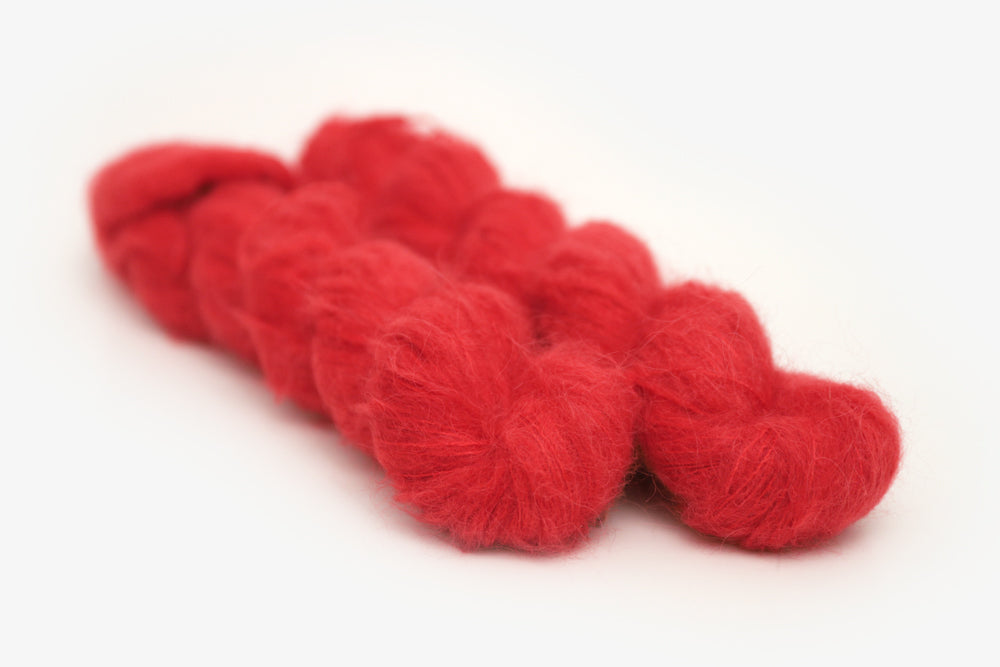 semisolid hand dyed cherry (bright christmas red) alpaca suri lace yarn 
