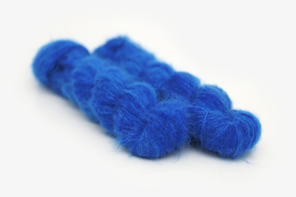 semisolid hand dyed cobalt (bright royal blue) alpaca suri lace yarn