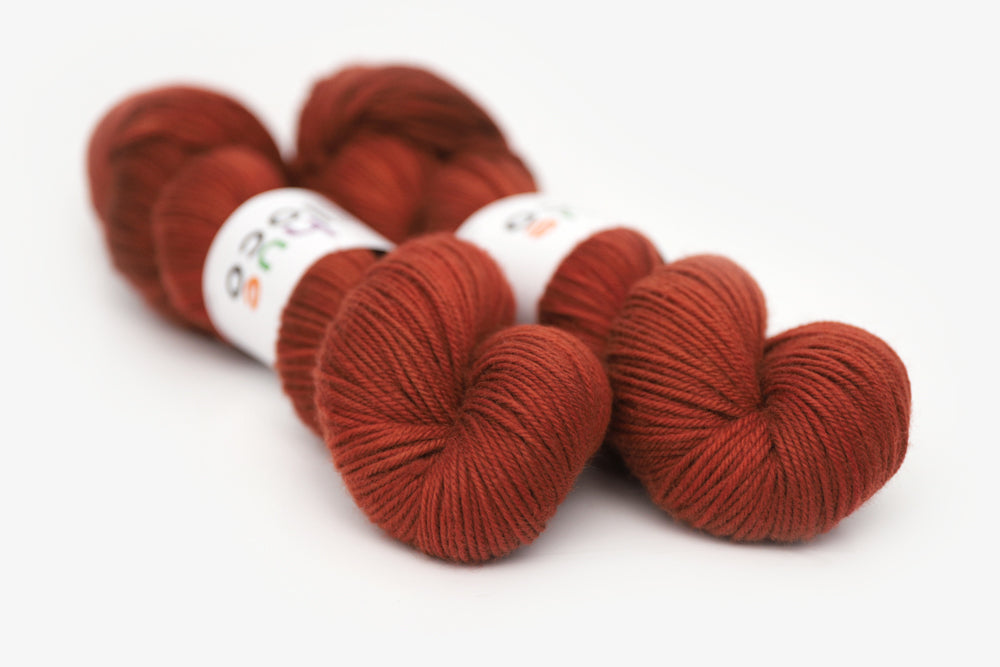 semisolid hand dyed dark rust red dk yarn