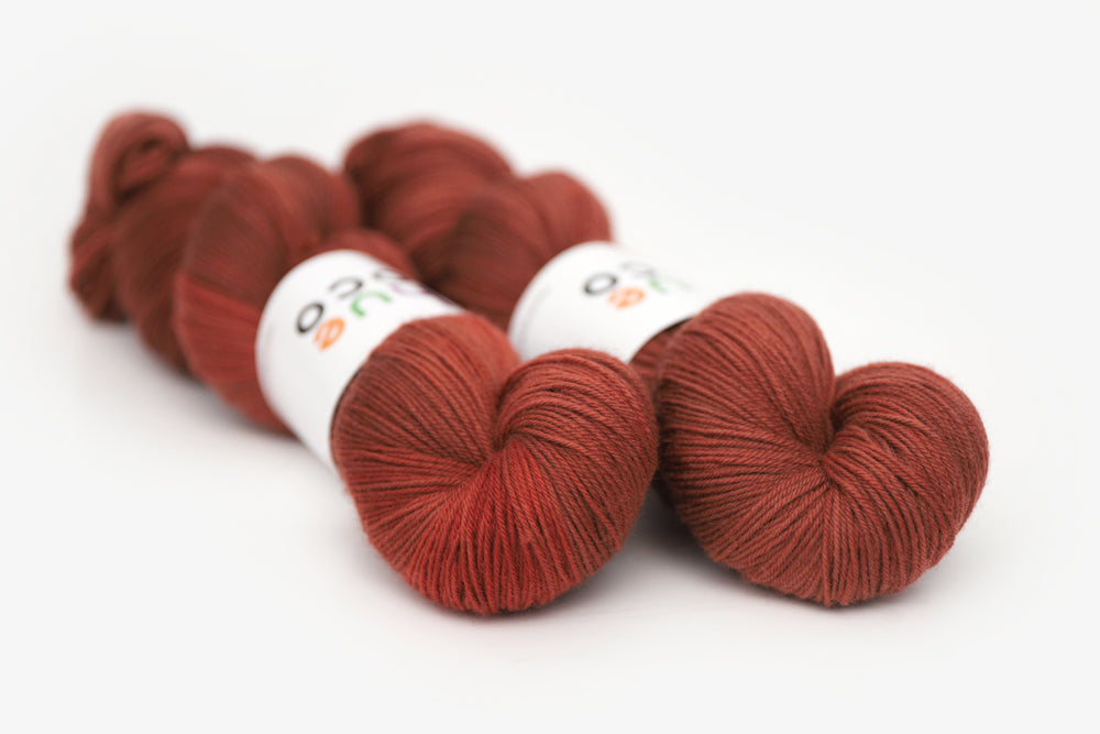 semisolid hand dyed dark rust red phyllis sock yarn