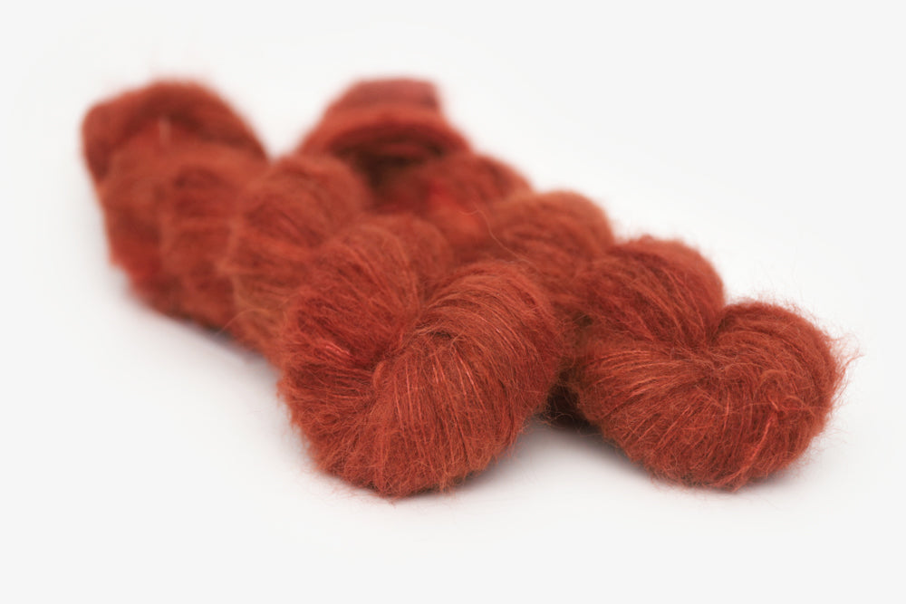 semisolid hand dyed dark rust red alpaca suri lace yarn