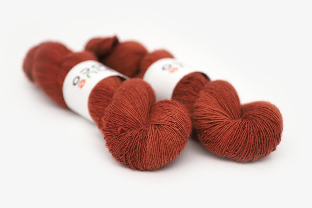 semisolid hand dyed dark rust red single sock yarn