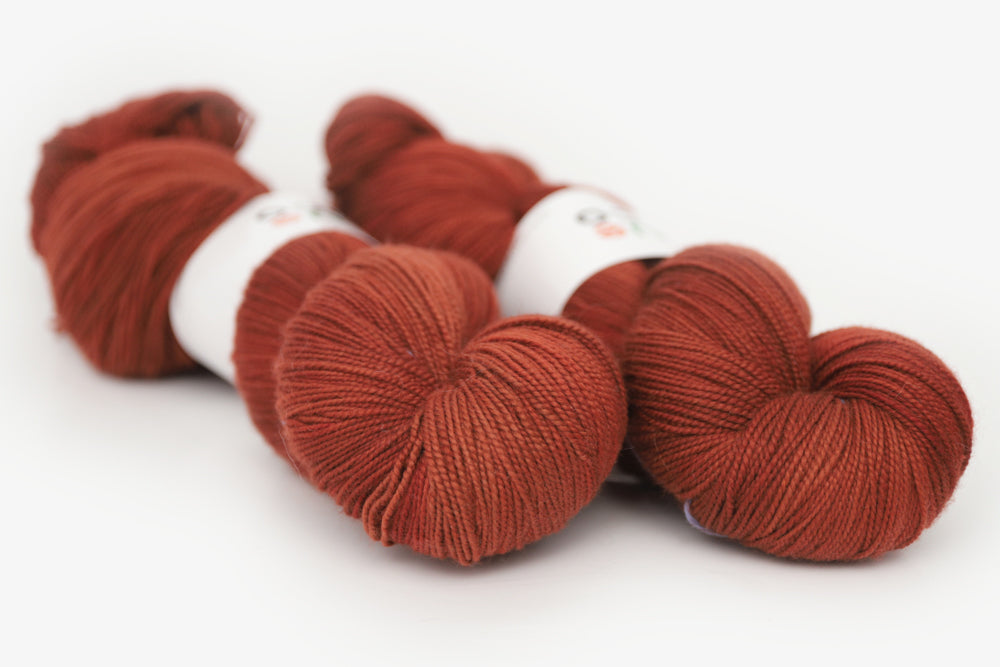 semisolid hand dyed dark rust red spun xl yarn