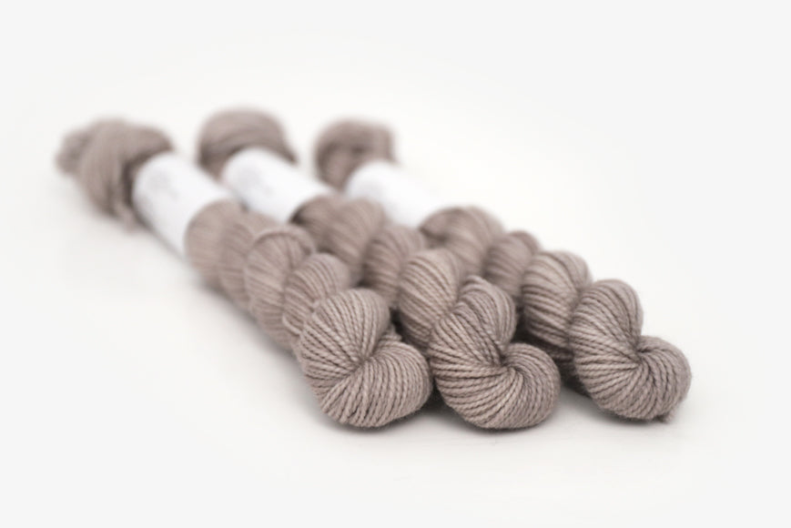 semisolid hand dyed warm greige gray merino sock mini yarn
