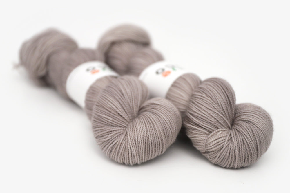 semisolid hand dyed warm greige gray merino sock yarn