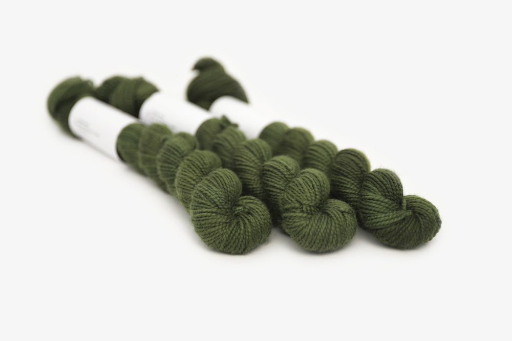 semisolid hand dyed dark forest green merino sock mini yarn