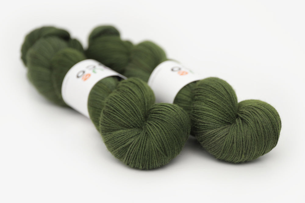 semisolid hand dyed dark forest green phyllis sock yarn