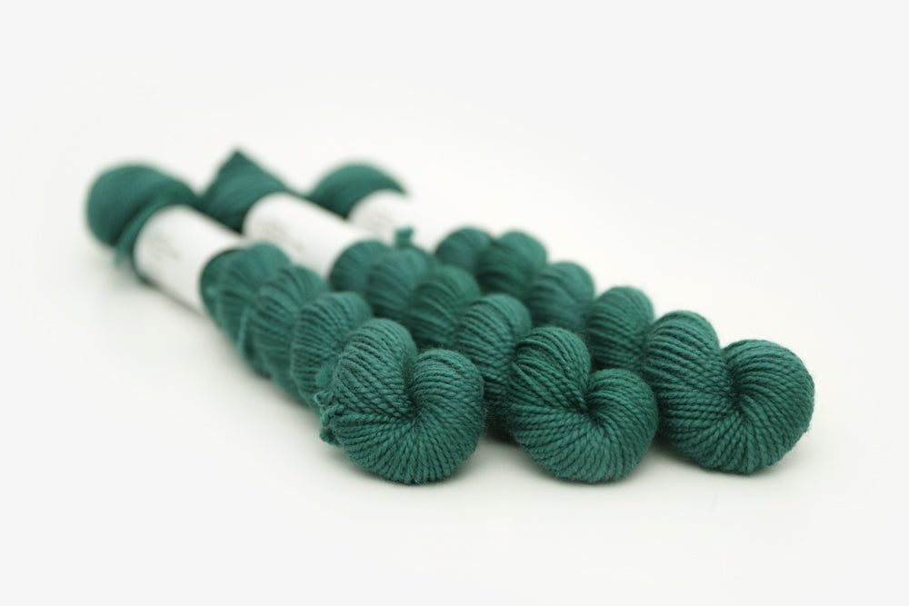 semisolid hand dyed emerald (dark blue green) merino sock mini yarn