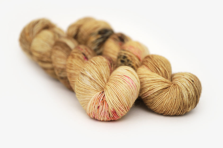 speckled hand dyed gold ochre fuchsia single sock yarn