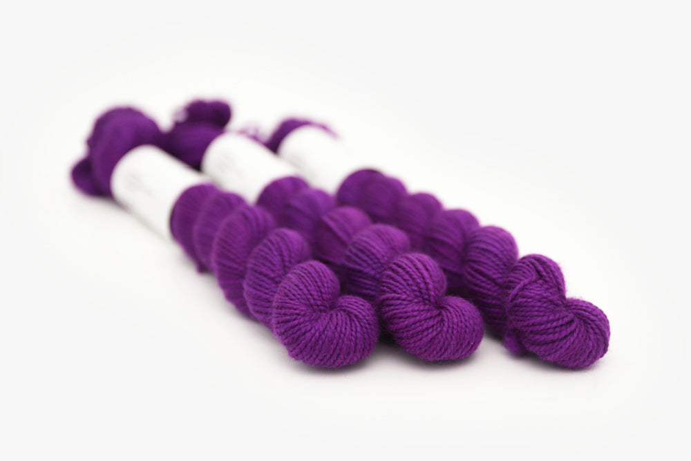 semisolid hand dyed bright pink purple merino sock mini yarn