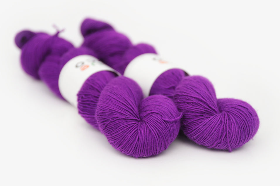 semisolid hand dyed bright pink purple single sock yarn