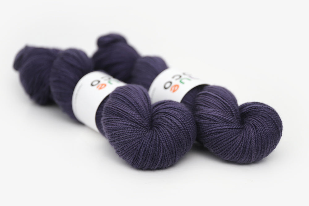 semisolid hand dyed juniper (dark navy purple blue) merino sock yarn