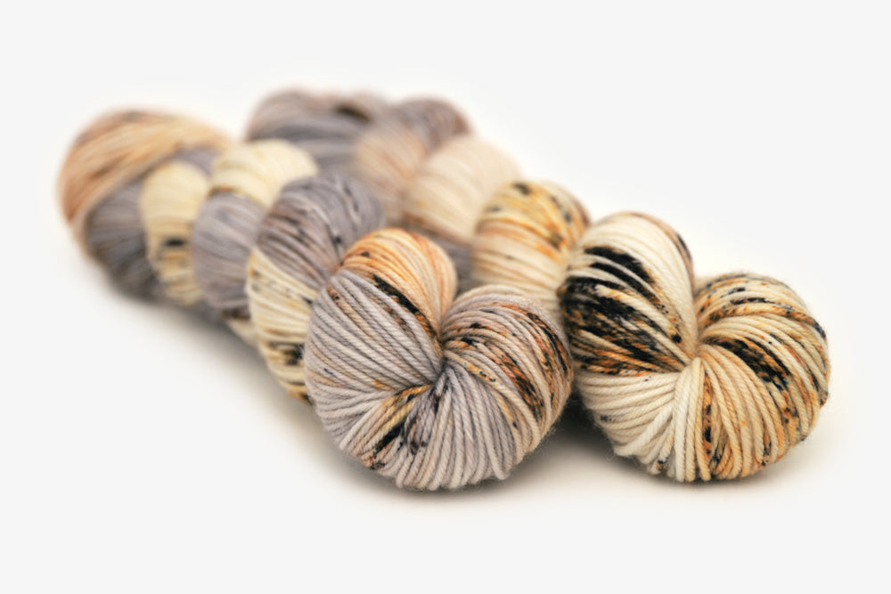 speckled hand dyed warm white gray brown maroon dk yarn