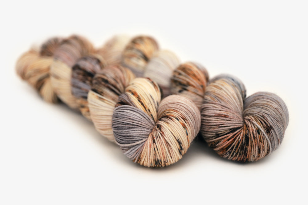 speckled hand dyed warm white gray brown maroon phyllis sock yarn