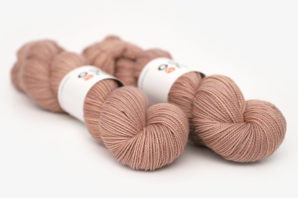 semisolid hand dyed mauve (taupe) merino sock yarn
