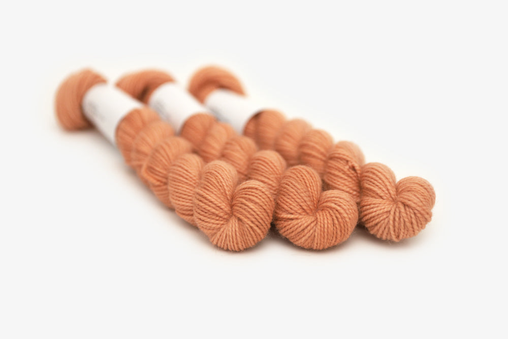 semisolid hand dyed nectarine (peach salmon orange) merino sock mini yarn