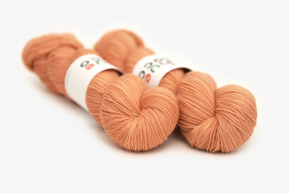 semisolid hand dyed nectarine (peach salmon orange) phyllis sock yarn