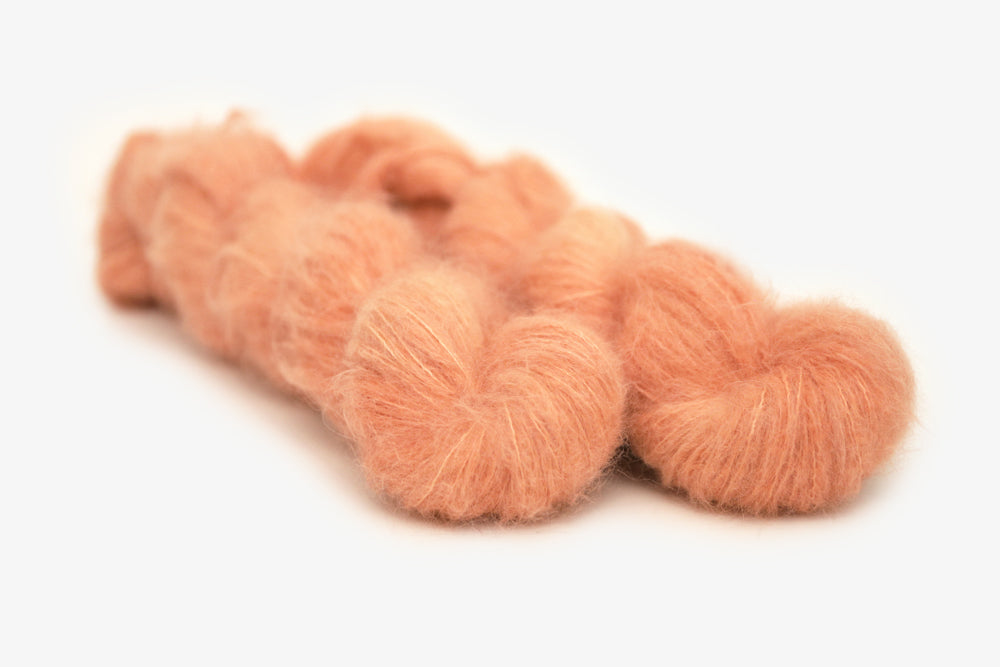 semisolid hand dyed nectarine (peach salmon orange) alpaca suri lace yarn