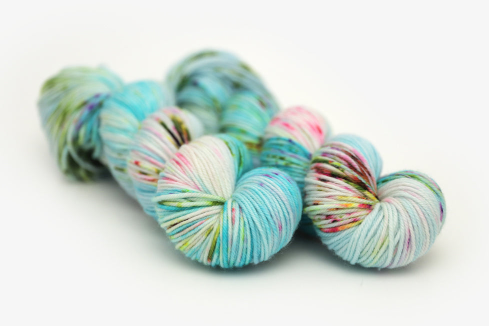 speckled hand dyed bright aqua green purple dk yarn