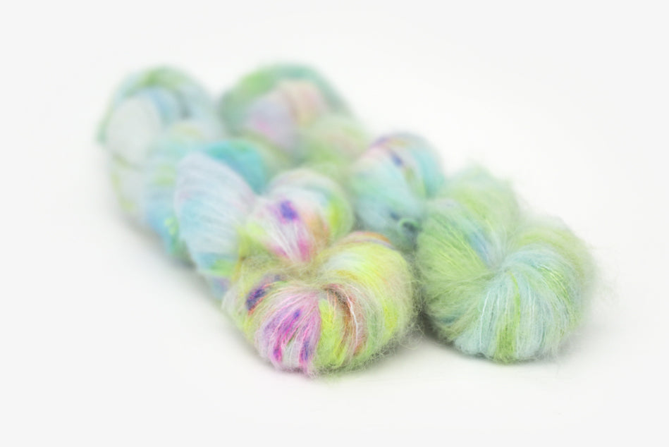 speckled hand dyed bright aqua green purple alpaca suri lace yarn