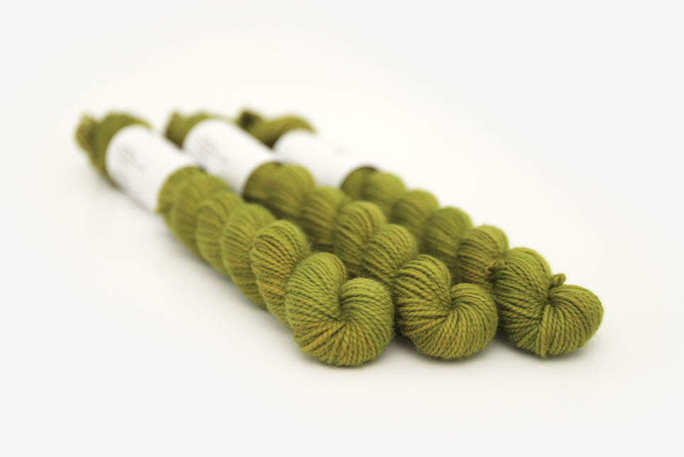 semisolid hand dyed pear (dark olive yellow green) merino sock mini yarn