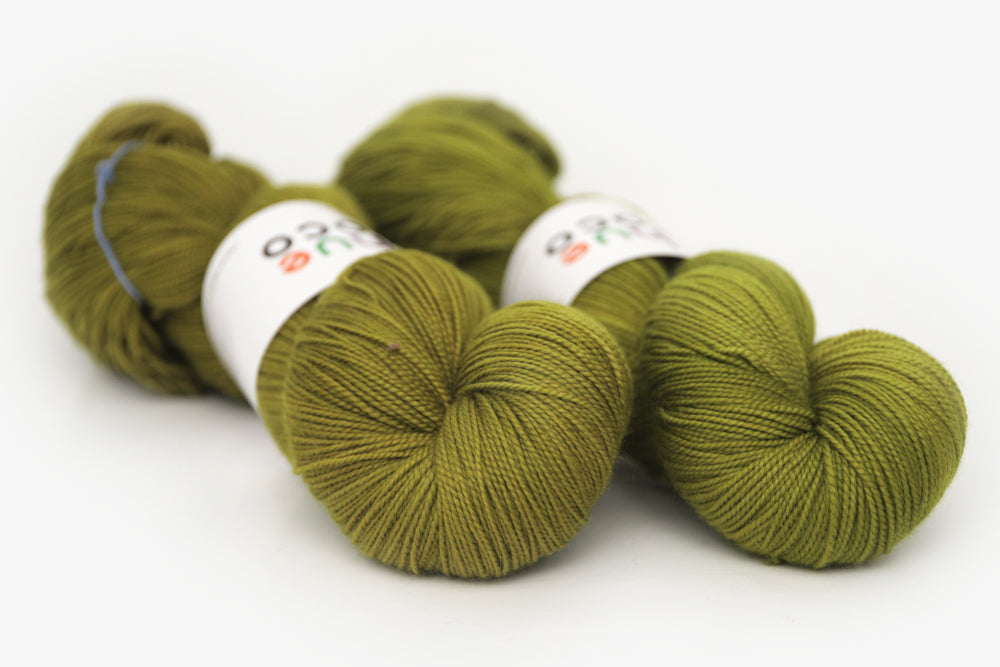 semisolid hand dyed pear (dark olive yellow green) spun xl yarn